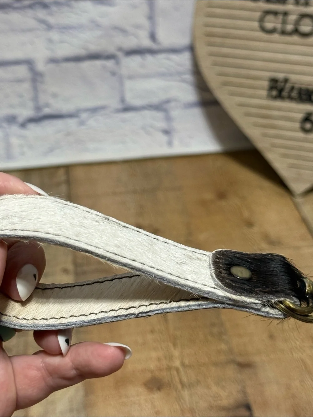keychain hair-on-hide cowhide strap paired with a brass hook